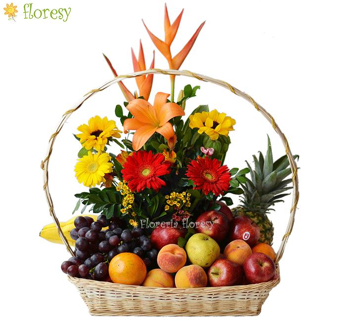 basket with fruits and flower arrangement